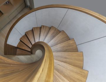 Metal Formed Staircase Coated with Danzer Vinterio Walnut 3D-Veneer - Location Villa in Hannover
