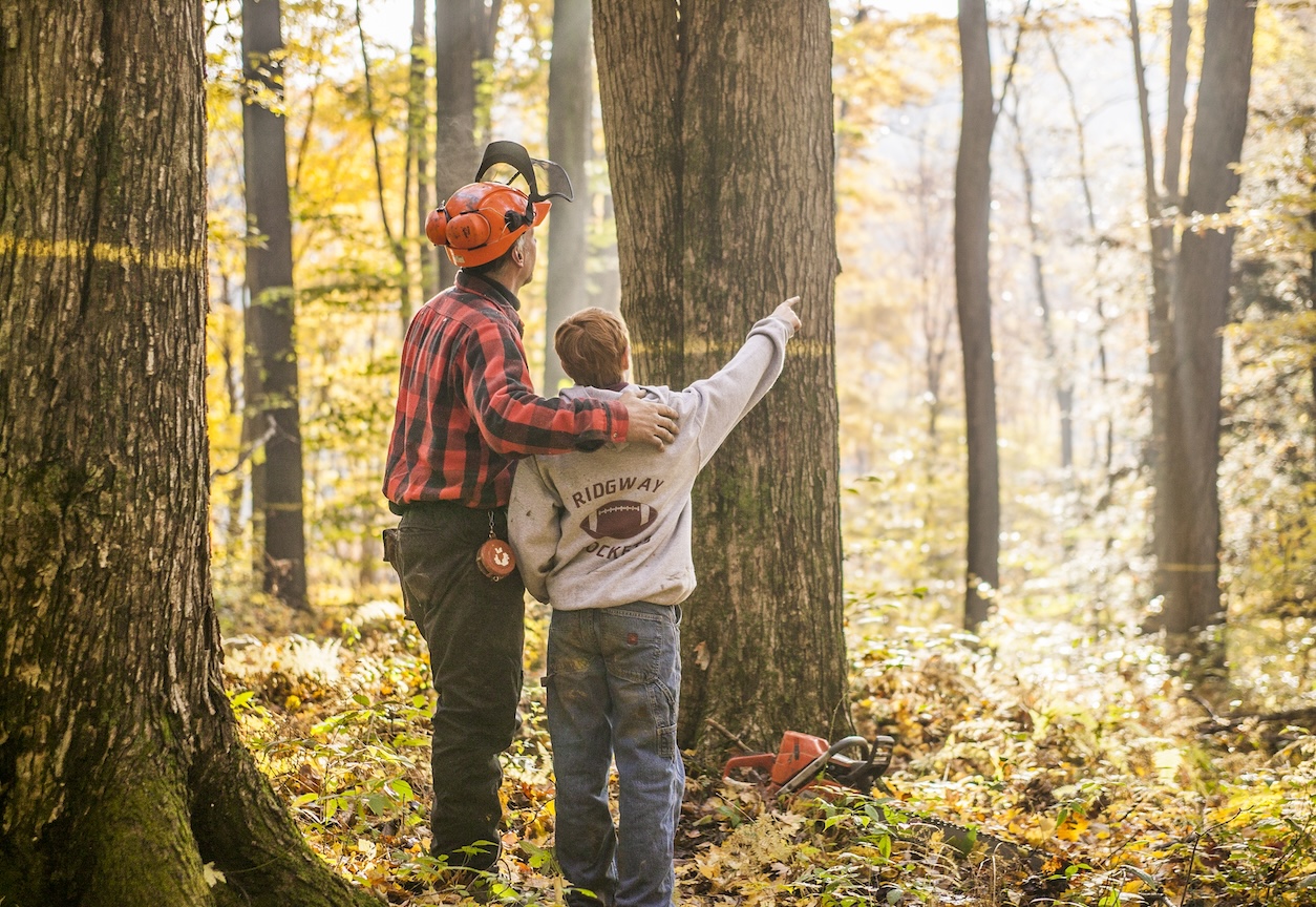 Man and Kid in Forest